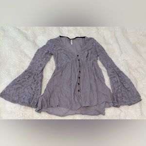 Women’s lavender long sleeved shirt, with lace detail, and size small.